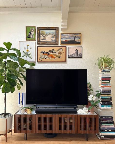 TV Stand Decor Ideas: 8 Ways To Elevate Your Living Room | Castlery US Tv Stand With Books, Gallery Wall With Tv Tv Stands, Tv Stand In Bedroom Ideas, Tv Stand Set Up, Tv Wall Decor Mid Century Modern, Wall Decor Above Tv Stand, Tv Unit Decoration Ideas, Plant Next To Tv, Styling Tv Wall