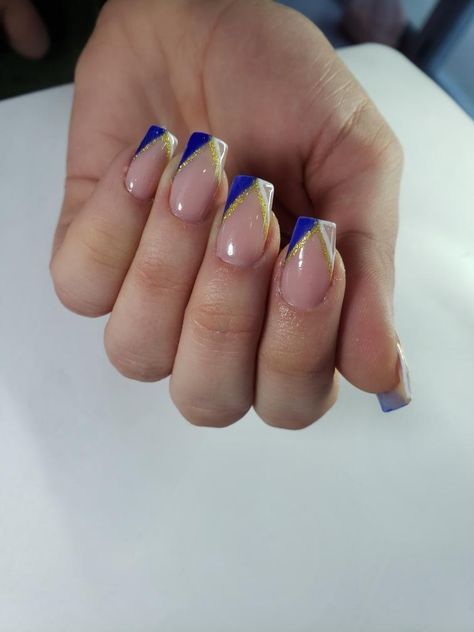 french nails with blue white and gold detalis 2022 nails Blue Gold French Tip Nails, Simple Blue And Gold Nails, Nail Art Designs Blue And Gold, Royal Blue And Gold Acrylic Nails Short, Blue And Gold Manicure, Short Acrylic Nails For Cheer, White And Royal Blue Nails Acrylic, Royal Blue White And Gold Nails, Nails With Blue And Gold