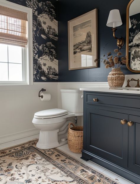 Struggling to make the most out of your small bathroom space? Explore our curated collection of 15 genius small bathroom design ideas that will inspire you to maximize functionality without compromising on style. Remodel Guest Bathroom, Bathrooms Walls Ideas, Small Bathroom Remodel With Wallpaper, Small Bathroom Blue Walls, Navy Wall Bathroom, Bold Bathroom Design, Blue Restroom Ideas, Decorate Above Toilet, Dark Toilet Room