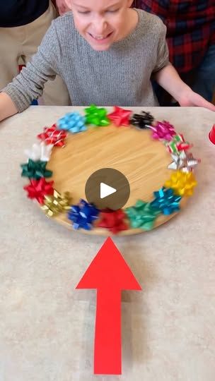 1.4M views · 6K reactions | Christmas Bow Spinner Game 🎁 #game #family #christmas | Benson Crew Last Minute Christmas Games, Christmas Bow Spinner Game, Christmas Games With Bows, Benson Brothers Christmas Games, Xmas Games For Adults, Xmas Games For Family, Cookie Exchange Games, Classroom Christmas Party Ideas, Christmas Bunco