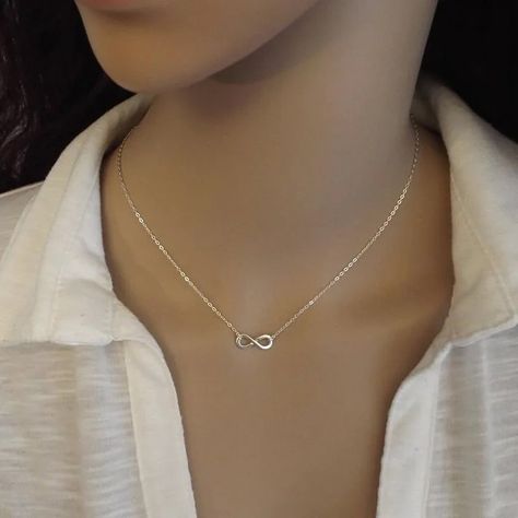 Infinity Abundance Pendant Choker Necklace Elevate your style with the Infinity Abundance Pendant Choker Necklace. Crafted from stainless steel, this elegant piece combines the infinity symbol with the concept of abundance. Ideal for women, it represents endless prosperity and makes a meaningful accessory for any occasion. #InfinityPendant #ChokerNecklace #StainlessSteelJewelry #FemmeNecklace #ElegantAccessory #FashionJewelry #ProsperityCharm #MeaningfulGift #AbundanceSymbol Infinity Pendant Necklace, Infinity Necklace Aesthetic, Silver Infinity Necklace, Infinity Necklace Silver, Engagement Necklaces, Pendant Choker Necklace, Pretty Jewelry Necklaces, Edgy Jewelry, Me Aesthetic