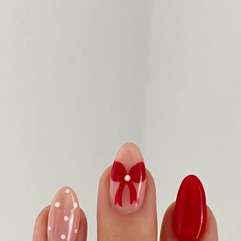 Charlotte Cliff on Instagram: "🎀❤️ anyone else obsessed with bows this year?   #nails #gelnails #rednails #bownails #bristol #nailsbristol #xmasnails #christmasnails #christmas #xmas #polkadotnails #nailart #naildesign" Christmas Bow Accent Nail, Easy Diy Valentine’s Day Nails, Red Christmas Nails With Bow Design, Christmas Nails 3d Bow, Pink And Red Christmas Bow Nails, Christmas Bow Nails Short, Nude Nails With Red Bow, Christmas Nails Bows Red, Valentine Bow Nails