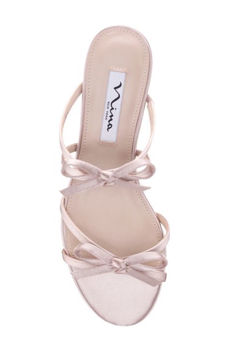 Delicate bows detail the straps of an elegant slide sandal set on a cushioned footbed and wrapped block heel. 1 1/2" heel Elastic gore inset Cushioned footbed Synthetic upper and lining/leather sole Imported Bridesmaid Shoes For Long Dresses Heels, Pretty White Heels, Bow Kitten Heels, Princess Shoes Aesthetic, Cute Kitten Heels, Coquette Sandals, Cute Prom Shoes, Block Heel Outfit, Elegant Sandals Heels