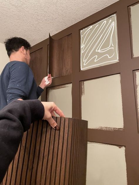 Bathroom Wallpaper Brown Cabinets, Stained Pole Wrap, Wood Beadboard Walls, Pole Wrap Kitchen Cabinet, Stained Beadboard Walls, Brown Beadboard, Reeded Cabinets, Wood Wall Paneling Ideas, Reeded Wall