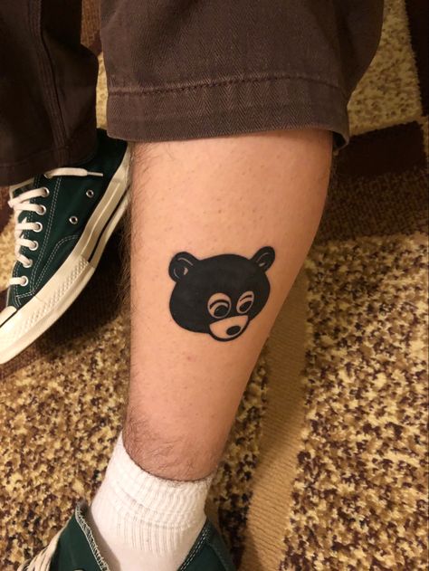 Kanye Graduation Tattoo, Parental Advisory Tattoo, Kanye West Bear Tattoo, Kanye Bear Tattoo, Kanye Inspired Tattoo, Kanye West Inspired Tattoo, Tattoo Ideas Small Words, Small Leg Tats, Ye Tattoo