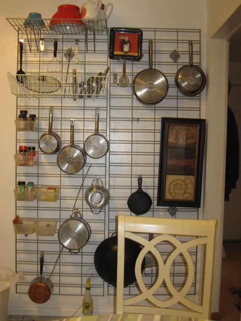 There was nothing quite satisfactory among all the kitchen things I looked at. This is a pair of grids from Grand & Benedict made for holding either slatwall or gridwall  fittings. It even holds some pegboard fittings. It adds storage and interest to an otherwise stark wall. Kitchen Utensil Storage, Grid Wall, Metal Counter Stools, Pan Storage, Broom Closet, Tiny House Plan, Small Pantry, Tiny Apartments, Kitchen Things