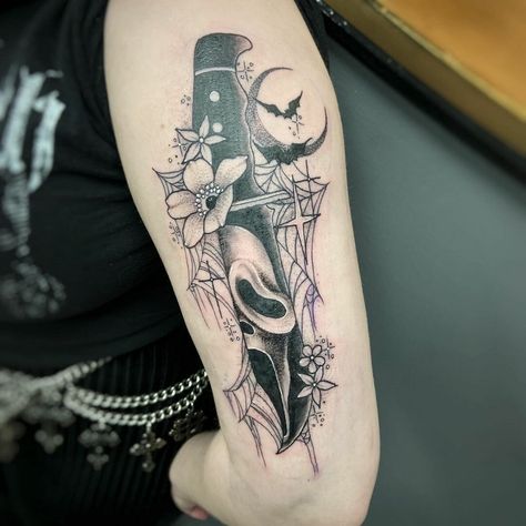 Wonderful Ghostface Tattoos With Floral Motif Scream Tattoo With Flowers, Horror Leg Sleeve Tattoo Women, Scream Movie Tattoo Ideas, What's Your Favorite Scary Movie Tattoo, Spooky Thigh Tattoos Women, Spooky Sleeve Tattoos For Women, Spooky Thigh Tattoo, Halloween Sleeve Tattoo For Women, Ghostface Tattoo Ideas