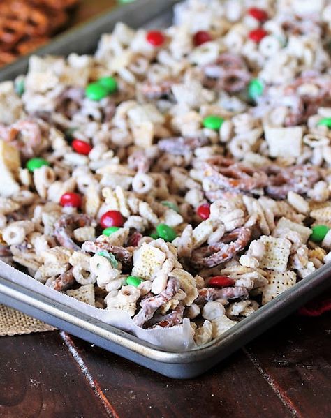 How to Make White Chocolate Reindeer Chow Snack Mix Image Chocolate Chex Mix Recipes, White Chocolate Snack Mix, Christmas Trash, Chocolate Snack Mix, White Chocolate Chex Mix, Chocolate Chex Mix, Christmas Snack Mix, Chocolate Reindeer, Reindeer Chow