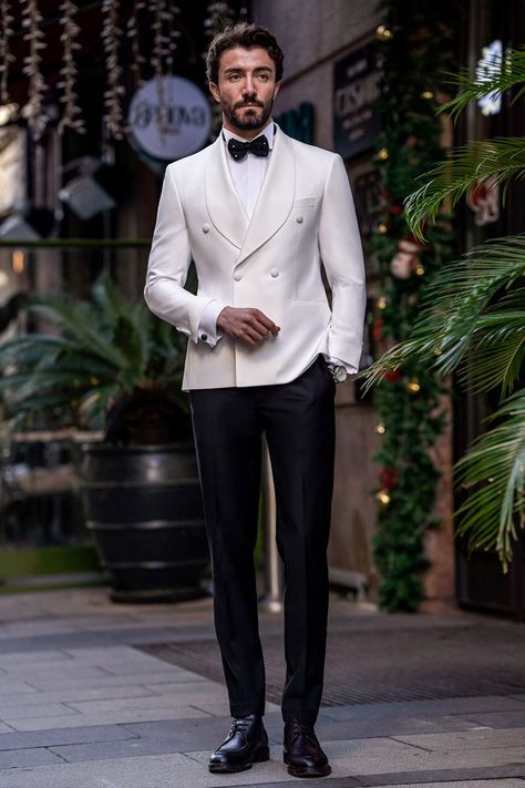 Flaunt your luxurious charm with the White Slim-Fit Tuxedo 3-Piece. The elegant white color and meticulously tailored fit offer a look of pure sophistication and class. Perfect for grand events and special occasions, this tuxedo guarantees you’ll make a stunning impression, exuding confidence and style.  #doublebreasted #whitetuxedo #tuxedo #suit #suits #slimfit #menstyle #menfashion #fashioninspo Classy Wedding Suits For Men, Modern Wedding Suits Men, Designer Tuxedo For Men, White Double Breasted Suit Men, Formal Tuxedo For Men, Royal Men Outfit, Best Suits For Men Wedding, Off White Suit Men, White Tuxedo For Men Wedding