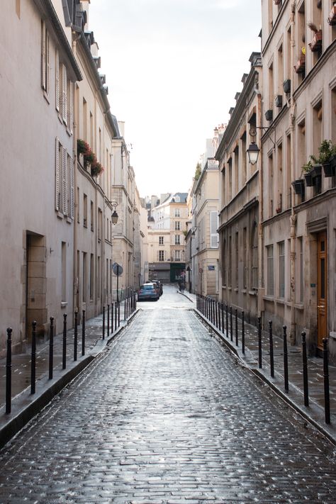 paris in the rain soaked cobblestone streets in the marais Streets In Paris, Paris Door, About Paris, Afternoon Light, Paris Guide, Yellowstone Park, Paris Summer, Cobblestone Streets, City Lifestyle