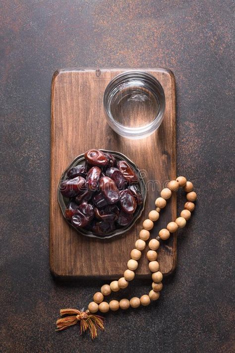 Ramadan. Dates in bowl, glass of water, wooden prayer beads on brown. Eid Mubara #Sponsored , #Sponsored, #AD, #bowl, #Ramadan, #Dates, #glass Dates Food Photography, Ramadan Photography, Dates Ramadan, Ramadan Dates, Arabic Aesthetic, Ramadan Photos, Islamic Photo, Arabic Dessert, About Ramadan