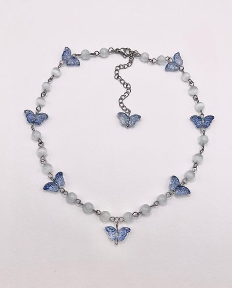 I had no idea what to name this baby but here she is! Butterfly Choker/Necklace 🦋 made with white cat eye beads, glass butterfly beads, stainless steel findings, and a stainless steel extension chain + lobster clasp 16.5in + 3in extension chain available now, link in bio 🦋 #handmade #butterfly #jewelry #explorepage