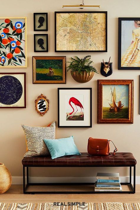 4 Smart Strategies for Creating a Stylish Gallery Wall | The secret to a cohesive gallery wall is patience—and a strong focal point. Start by hanging an anchor piece and build out from there over time. Aim to have at least one unifying principle (color scheme, frame material, art style) among everything you hang. #renovationideas #realsimple #remodeltips #homedecorideas #decorinspo #details Wall Picture Design, Commode Shabby Chic, Gallery Wall Layout, Eclectic Gallery Wall, Diy Wand, Gallery Wall Living Room, Shabby Chic Dresser, Wall Gallery, Inspiration Wall