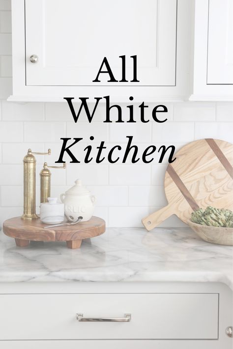 Some people think an all white kitchen is boring but I'm here to tell you it's anything but! Learn how to make simple updates that will keep your kitchen exciting and fresh. Accessories For A White Kitchen, Small White Kitchen Decor Ideas, Simple White Kitchen Decor, Accessories For White Kitchen, White Kitchen With Brushed Nickel, Pretty White Kitchen, Kitchen Remodel White Counter Tops, Off White Kitchen Countertops, White Kitchen Styling Ideas