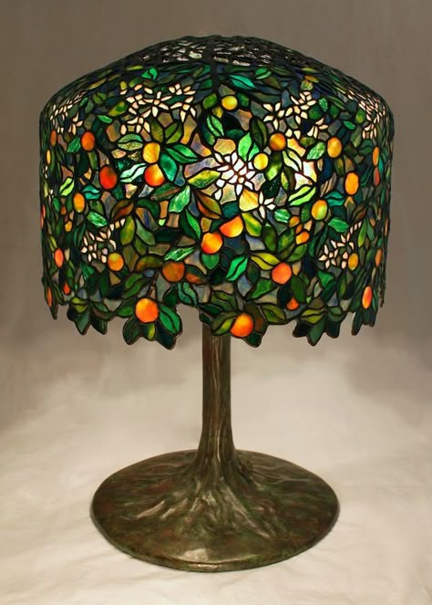 18″ Calamondin Orange Tree lamp. The lamp is an original Century Studios lamp design by Bill Campbell (see the previous post for our design inspiration). The lamp was designed to utilize the Tiffany 18″ Wisteria crown and form, and is now in a private Midwest collection. With just under 2050 individual... Wisteria Tiffany Lamp, Orange Lighting Room, Tiffany Glass Lamp, Tiffany Lamp Aesthetic, Calamondin Orange Tree, Fun Lamps, Interesting Lamps, Bill Campbell, Studio Lamp