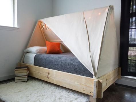 Inspire a spirit of adventure or just create a cozy hideaway for your kid with this adorable tent bed. Toddler Bed Tent, Diy Bed Tent, Kids Bed Tent, Toddler Tent, Tent Bed, Teepee Bed, Diy Tent, Kids Rooms Diy, Bed Tent