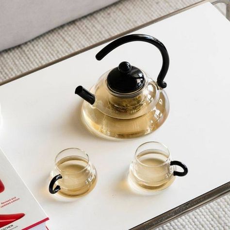 Elevate your tea time with our modern transparent and black Japanese-style tea pot and tea cups. Embrace the art of tea drinking with sleek design and timeless elegance. 🍵✨ . . . #TeaTime #JapaneseStyle #ModernElegance Tea Pot Aesthetic, Tea Set Aesthetic, Modern Tea Set, Glass Tea Pot, Art Of Tea, Glass Tea Set, Shoe Rack Living Room, Teapot Set, Cha Bar