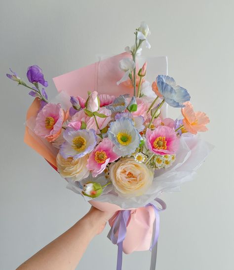 this was one of the first big bouquets we worked when our colourful poppy bouquet started to become popular and on avg it took me 3-4 hours to get one right. One of my biggest advice for aspiring florists is to practice as much as you can 💗🌷 Small Whimsical Bouquet, Colourful Flower Arrangements, Unique Bouquet Ideas, Big Flower Bouquet, Poppies Bouquet, Tulip Flower Pictures, Garden Party Aesthetic, Dreamy Cottage, Poppies Flower