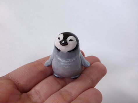 This figurine of baby penguin is completely handmade from a polymer clay. Then painted with acrylic paint and finished with glossy varnish. Size: 3,5 cm ( 1,3 inch) The figurine arrives in a gift handmade box. Please, dont use it as a toy for small children. More of unique gifts you Polymer Clay Small Figures, Clay Penguin Sculpture, Penguin Clay Art, Small Clay Animals, Tiny Clay Things, Penguin Habitat, Polymer Clay Penguin, Clay Penguin, Penguin Sculpture