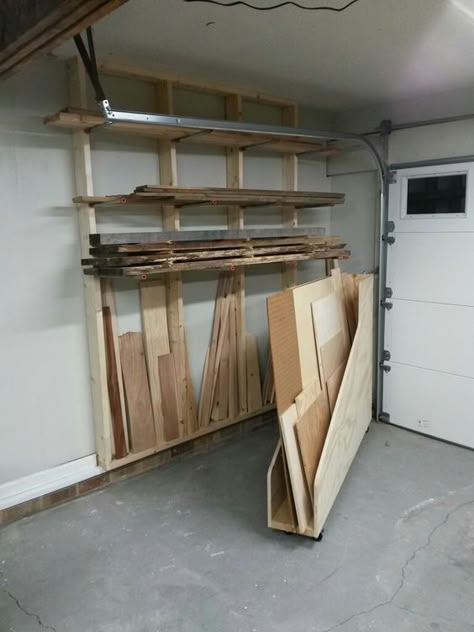 Lumber storage area. Horizontal storage for longer pieces, and a plywood rack that swings out to reveal vertical storage for shorter pieces. Small Garage Organization, Diy Projects Garage, Garage Organization Systems, Garage Organization Tips, Garage Organizing, Lumber Storage, Garage Organization Diy, Garage Organization Ideas, Garage Storage Ideas