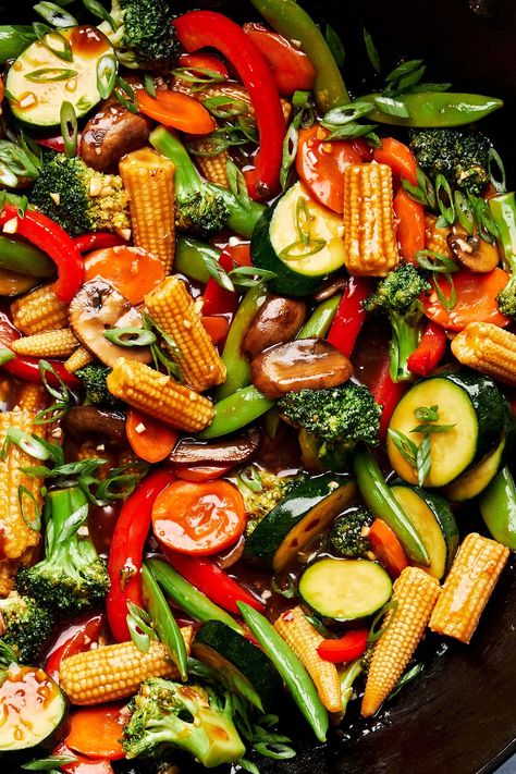 We love this easy veggie stir fry for its delicious homemade sauce and super customizable ingredient list. Make a pot of rice, and dinner is served! Veggies For Stir Fry, Vegan Veggie Stir Fry, Dinner Recipes With Lots Of Vegetables, Stir Fry Veggies Sauce, Healthy Vegetable Stir Fry Recipes, Coconut Aminos Stir Fry, Teriyaki Veggie Stir Fry, Asian Veggie Stir Fry, Stir Fry Snap Peas