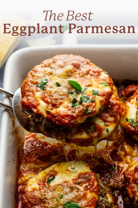 an image of a spatula lifting eggplant parmesan out of a white baking dish with the words "the best eggplant parmesan" above the image. Eggplant Parm Stacks, Eggplant Parmeggiano, Eggplant And Chicken Parmesan, Eggplant Parmesan Roll Ups, Vegetarian Italian Dishes, Fried Eggplant Parmesan, Eggplant Parmesan Recipes, Italian Eggplant Recipes, Best Eggplant Parmesan