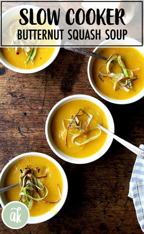 Slow-cooker Butternut Squash and Apple Soup — a fall favorite. The flavors of this butternut squash soup are so pure—the apple and carrots provide a touch of sweetness, the coconut milk a hint of richness. It couldn't be simpler: throw everything into a slow cooker with some water and let it cook for 4 to 8 hours. When it's time to serve, plunge in your immersion blender and purée with some coconut milk. That's it! #butternut #squash #soup #slowcooker #crockpot #apple Slow Cooker Butternut Squash Soup, Slow Cooker Butternut Squash, Apple Soup Recipes, Recipe Butternut Squash, Squash And Apple Soup, Squash Apple Soup, Butternut Squash Apple Soup, Crockpot Apple, Butternut Squash Apple