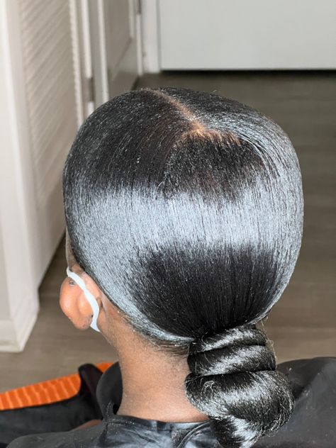 Sleek Low Ponytail Black Women Middle Part, Black Low Bun Hairstyles, Low Bun Knot Black Women, Sleek Low Bun Black Women Middle Part, Middle Part Top Knot Bun, Low Bun Middle Part Black Women, Low Knot Bun Middle Part, Low Bun Ponytail Black Hair, Slik Bun Short Hair