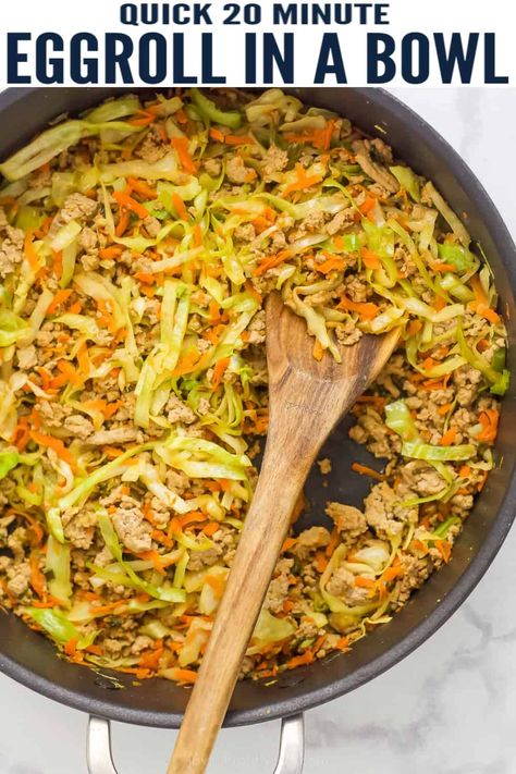 This 20-minute Egg Roll in a Bowl is the perfect quick and easy weeknight dinner. Ground turkey is cooked with scallions, ginger and garlic then tossed with cabbage, carrots, sriracha and soy sauce. It tastes just like the fried egg roll filling from your favorite restaurant - but without the grease. #eggroll #asianfood #bowlrecipes #lowcarbrecipes #ketorecipes #dinnerideas Cooking With Ginger, Pork Egg Rolls, Eggroll In A Bowl, Egg Roll In A Bowl, Pork And Cabbage, Healthy Bowls Recipes, Egg Roll Recipes, Healthy Bowls, Slaw Recipes