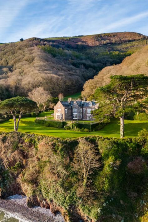 The perfect home if you REALLY love your commute. A 77-acre cliffside estate with what is thought to be one of the longest driveways in England has come to the market for £7 million (US$8.73 million). Glenthorne House, in the South West of the country, is what sits at the end of the 2.5-mile-long zig-zagging driveway that took almost a year to build. Country Estate Homes England, Country Estate Homes, English Manor Houses Country Estate, Cliffside Mansion, British Country House, British Estate, English Country Houses, House On Hill, Cliffside House