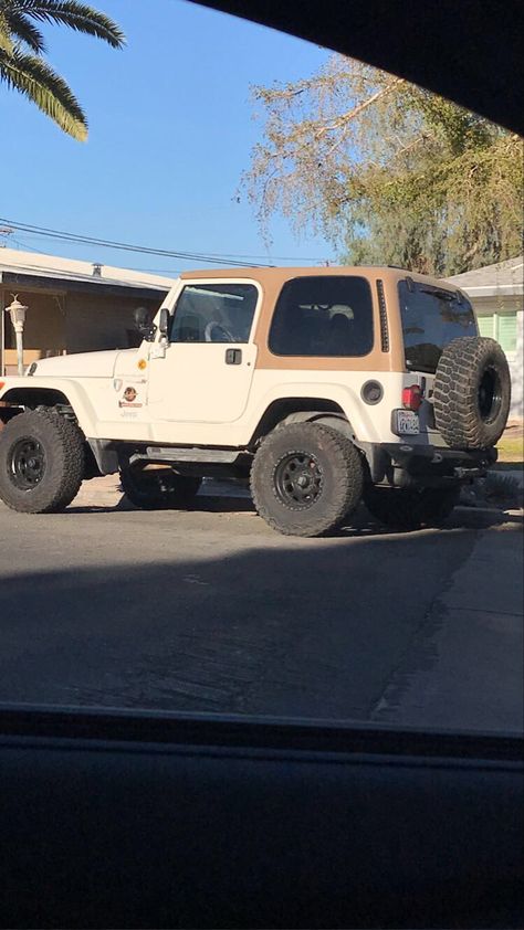 Brown and tan vintage Jeep on road Brown Jeep Aesthetic, Jeep Wrangler Old Model, Older Jeep Wrangler, 2000s Jeep Wrangler, Cream Jeep Wrangler, Vintage Jeep Aesthetic, Jeep Wrangler Brown Interior, Aesthetic Jeep Interior, Old Jeeps Vintage