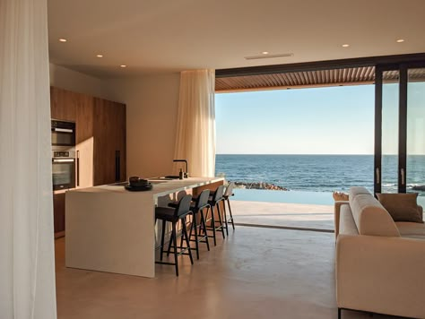 Modern House Sea View, House Beside The Sea, Kitchen With Beach View, Sea Side House Interior, Houses Near The Sea, Beach View From House, Home With Beach View, Sea View Living Room, Sea Villa Beach Houses