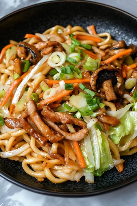 Quick and easy, yaki udon is sure to be a weeknight favorite! This Japanese dish features chewy udon noodles, tender meat, and crisp vegetables, all coated in a savory sauce. Udon Noodle Chicken, Japanese Food Healthy, Udon Chicken, Japanese Recipe Ideas, Udon Noodle Recipe, Udon Stir Fry, Japanese Food Recipes, Udon Noodles Recipe, Fried Udon