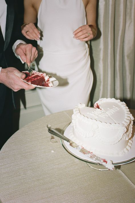 Couple share a piece of their red velvet wedding cake. Vintage, all white wedding cake with piping. 70s style.   At Graydon Hall Manor. Wedding Cake With Piping, Cake With Piping, All White Wedding Cake, Wedding Cake Vintage, Red Velvet Wedding, Heart Shaped Wedding Cakes, Red Velvet Wedding Cake, Graydon Hall Manor, Vintage Italian Wedding