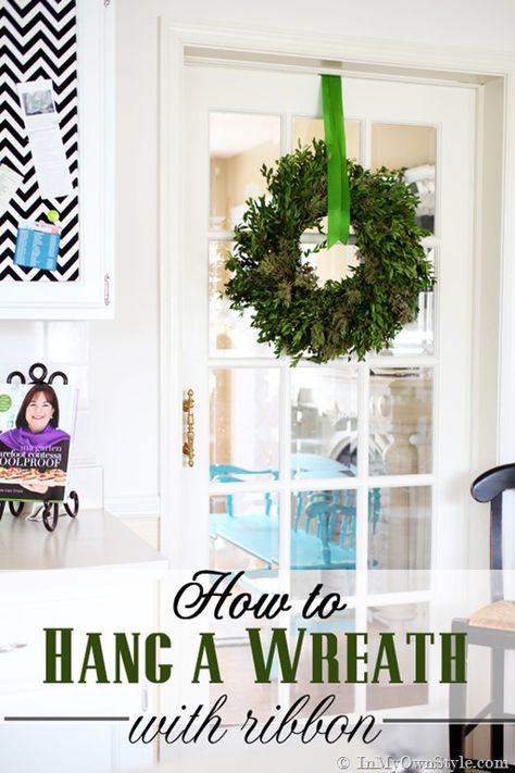 Christmas decorating idea using greenery. Decorating idea for hanging a Christmas wreath and ribbon. Hang A Wreath With Ribbon, Wreath With Ribbon, Wreath Hanging, Valentine's Day Decorations, Seasonal Living, Rustic Christmas Wreath, Deco Mesh Christmas Wreaths, Diy Aesthetic, Easy Christmas Wreaths