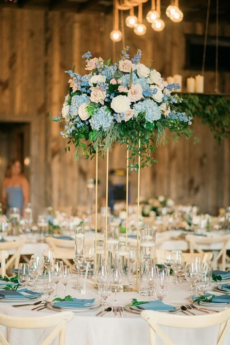 Centerpieces With Blue Hydrangeas, Tall Blue Centerpieces, French Blue And Gold Wedding, Hydrangea And Rose Centerpiece, Tall Round Table, Blush Spray Rose, Tall Flower Centerpieces, Royal Blue Centerpieces, Delphinium White