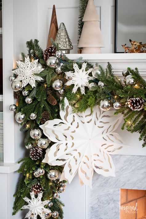 Want to elevate your holiday home with some mantel magic? Delve into fresh takes on timeless decorations, offering a unique blend of the old and the new. These easy-to-follow ideas promise a mantel that's both charming and conversation-worthy this Christmas season. Let this be your go-to guide for all of your Christmas decorating inspiration. Winter Garland Mantle, Decorating Garland, Decorate A Fireplace, Fireplace Mantel Ideas, Handmade Christmas Decor, Mantel Christmas, Mantel Decorating Ideas, Wonderland Decorations, Wonderland Christmas