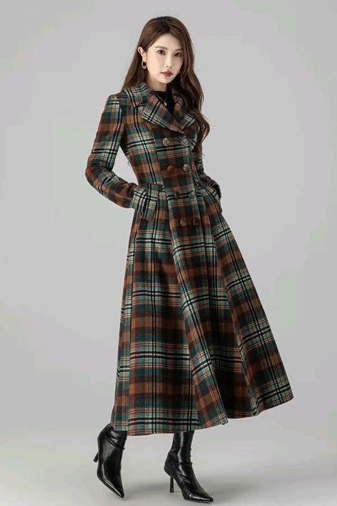 This Plaid Vintage inspired Long wool coat is a stylish addition to any wardrobe. Made with high-quality wool, this coat offers superior warmth and comfort. Its classic plaid pattern adds a touch of vintage charm, making it a timeless piece that will never go out of style.

DETAIL

* Wool composition " 50% wool blend + fiber + nylon" ;
* Absolutely fantastic coat! Very well-made and fully lined (matching satiny material).
* Double breasted wool coat
* Plaid wool coat
* Two pockets
* Long sleeves
* Notch lapel
* Fit and flare coat, dress coat
* Perfect for winter, autumn
* Dry clean