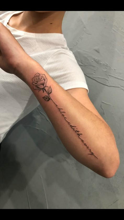 Rose Quote Tattoo Forearm, Quote With Rose Tattoo, Rose Four Arm Tattoo, Tattoos For Women Roses Arm, Rose And Writing Tattoo, Rose Words Tattoo, Flower Tattoo With Words As Stem Arm, Rose With Writing Stem Tattoo, Rose With Signature Tattoo