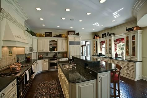 If you have a question when remodeling kitchen Verde Butterfly granite gives the answer. White creamy glazed cabinets along with travertine backsplash created very smooth transition plus dark espresso tile. #verdebutterflygranite #verdebutterflygranitecountertops #verdebutterflygranitekitchencounters #creamyglazedcabinets #creambacksplash #creamycabinets #travertinebacksplash #darkwoodfloor Kitchen Cabinets With Dark Granite, Green Granite Kitchen, Kitchen Countertops Granite Colors, Countertop Design Ideas, Green Granite Countertops, White Granite Countertops Kitchen, Dark Granite Countertops, Glazed Cabinets, Granite Tile Countertops