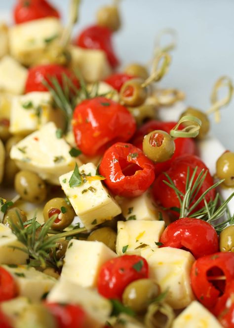 Marinated Cheese & Olive Skewers Cheese Olive Skewers, Olive And Cheese Platter, Feta Skewers Appetizers, Appetizer With Olives, Holiday Party Menu Ideas Appetizers, Olives For Charcuterie, Olive Appetizer Ideas, Tooth Pick Appetizers, Marinated Cheese And Olives