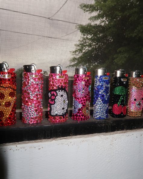 Bedazzle lighters DROP IS LIVE NOW!!! ⭐️⭐️⭐️ there is only 1 of each design available… website in bio Bedazzle Lighter, Bedazzle Aesthetic, Bedazzled Lighter Diy, Diy Lighter Design, Decorating Lighters, Lighters Decorated Diy, Lighter Decor, Bedazzled Designs, Lighter Decoration