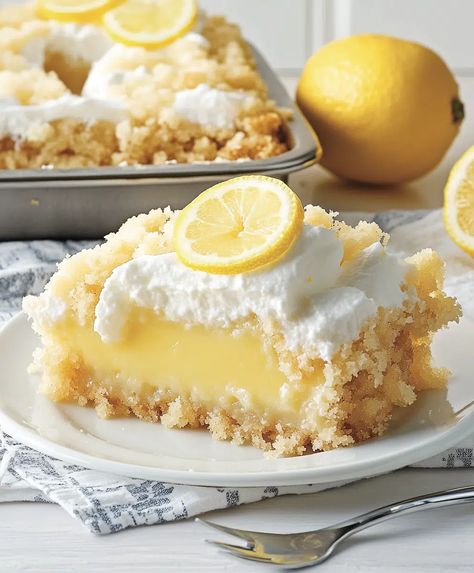 Lemon Cream Cheese Dump Cake Recipe - sandyrecipes.com Lemon Cream Dump Cake, Creamy Lemon Desserts, Lemon Cream Cheese Dump Cake 12 Tomatoes, Lemon Cake Mix Ideas, Lemon Cake With Cream Cheese Frosting, Lemon Cream Cheese Dump Cake Recipe, Lemon Pie Filling Recipes, Lemon Cake Mix Recipes, Lemon Cream Cheese Dump Cake