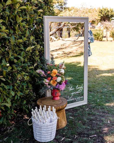 Give your wedding guests a warm welcome by ushering them into your garden wedding with a gorgeous mirrored sign. Hannah & Jordan also included pretty sun parasols for their beautiful sunny afternoon wedding. @ashhughesweddings #weddingmirror #gardenwedding #gardenweddingstyle #gardenweddingideas #geelongweddings #geelongbrides Backyard Wedding Welcome Sign, Garden Wedding Signs, Mirrors At Weddings, Back Garden Wedding Uk, Garden Wedding Welcome Sign, Backyard Garden Party Wedding, Garden Wedding Ideas Ceremony, Mirror At Wedding, Wedding Sign With Flowers