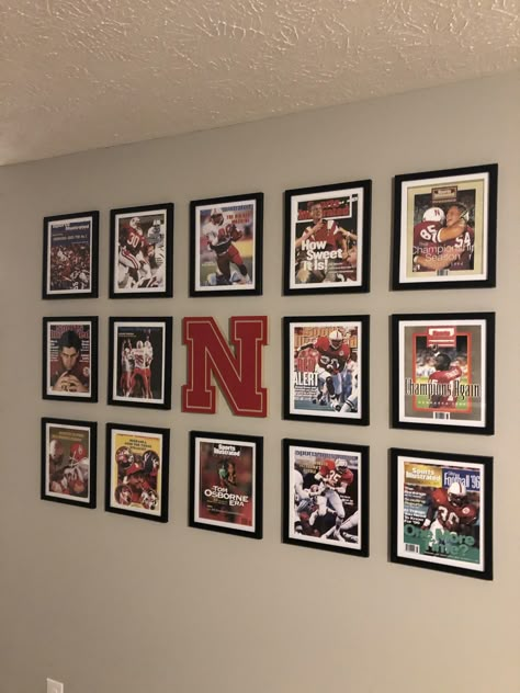 Sports gallery wall. Man cave Sports Photo Wall Display, Sports Picture Wall Ideas, Sports Room Decor Man Caves, Sport Gallery Wall, Basement Picture Wall Ideas, Basement Sports Decor, Man Cave Sports Room, Sports Memorabilia Display Wall, Sports Office Decor Ideas