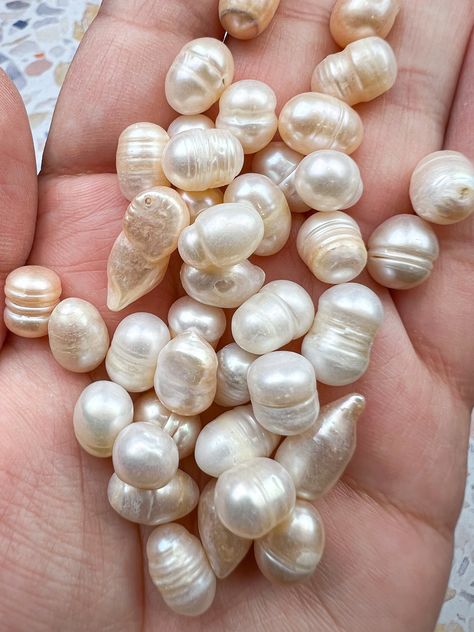 Free Canada-wide shipping on orders over $150.  Follow us on Instagram @crystalcodeapothecary for special deals! Fresh Water Pearls - can be used for jewelry making, home decor, blessing bags, artwork, and more! These pearls DO NOT have drill holes.  Note: You will receive TEN intuitively selected fresh water pearls, similar to those pictured. These are natural pearls and may therefore have natural imperfections. These are decorative items and do not replace medical or professional support. Came Fresh Water Baroque Pearl, Making Jewelry Aesthetic, Aesthetic Pearls, Pearls Aesthetic, Blessing Bags, Traditional Aesthetic, Mermaid Core, Pearl Gifts, Pearls Jewelry