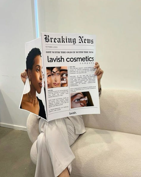 A person sitting on a modern couch holding a newspaper featuring bold headlines about 'lavish cosmetics' with images of diverse beauty models. This cosmetics branding mockup provides inspiration for innovative, editorial-style photoshoots, perfect for graphic designers and businesses looking to create fresh, impactful visuals for brand promotions. Business Owner Photoshoot, Newspaper Mockup, Cosmetics Branding, Cosmetics Company, Business Photoshoot, Branding Photoshoot Inspiration, Aesthetic Content, Personal Branding Photoshoot, Shotting Photo