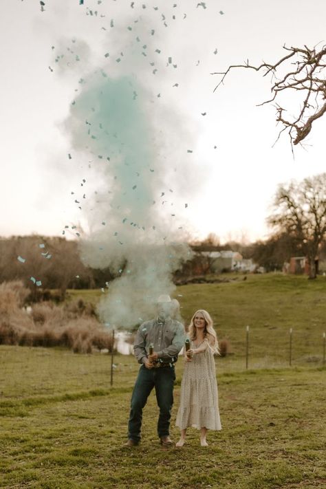 Surprise! Baby Elrod is a boy! We are beyond excited to welcome our little cowboy into the world in August 2022! We of course had to do a fun gender reveal photo to share the exciting news with the world! #ranchbaby #westernbaby #cowboycouple #westernphotoshoot #genderreveal #babyboy #boymom #momlife #ranchmom Gender Reveal Ideas With Cows, Gender Reveal Boy Announcement, Western Baby Gender Reveal Ideas, Western Baby Reveal Ideas, Shooting Gender Reveal Ideas, Highland Cow Gender Reveal Ideas, Western Theme Gender Reveal Ideas, Country Gender Reveal Ideas, Western Gender Reveal Ideas