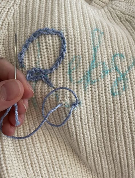 How To DIY a Hand Embroidered Name Sweater • Emily Rone Home How To Sew Names On Sweaters, Chunky Name Sweater Diy, Hand Embroider Name On Shirt Diy, How To Hand Stitch Name On Sweater, Yarn Writing On Sweater, Diy Hand Embroidered Sweater, How To Embroider A Name, Chain Stitch Name Sweater, Embroider Names Diy Hand Embroidery