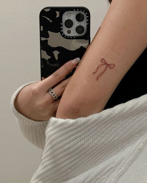 Small Tattoo Ideas Back Of Arm, Small Arms Tattoos, Dainty Ribbon Tattoo, Bow Arm Tattoo, Ribbon Tattoos Bow, Tiny Bow Tattoo, Small Tattoo Ideas Women, Little Bow Tattoo, Small Tattoos On Arm